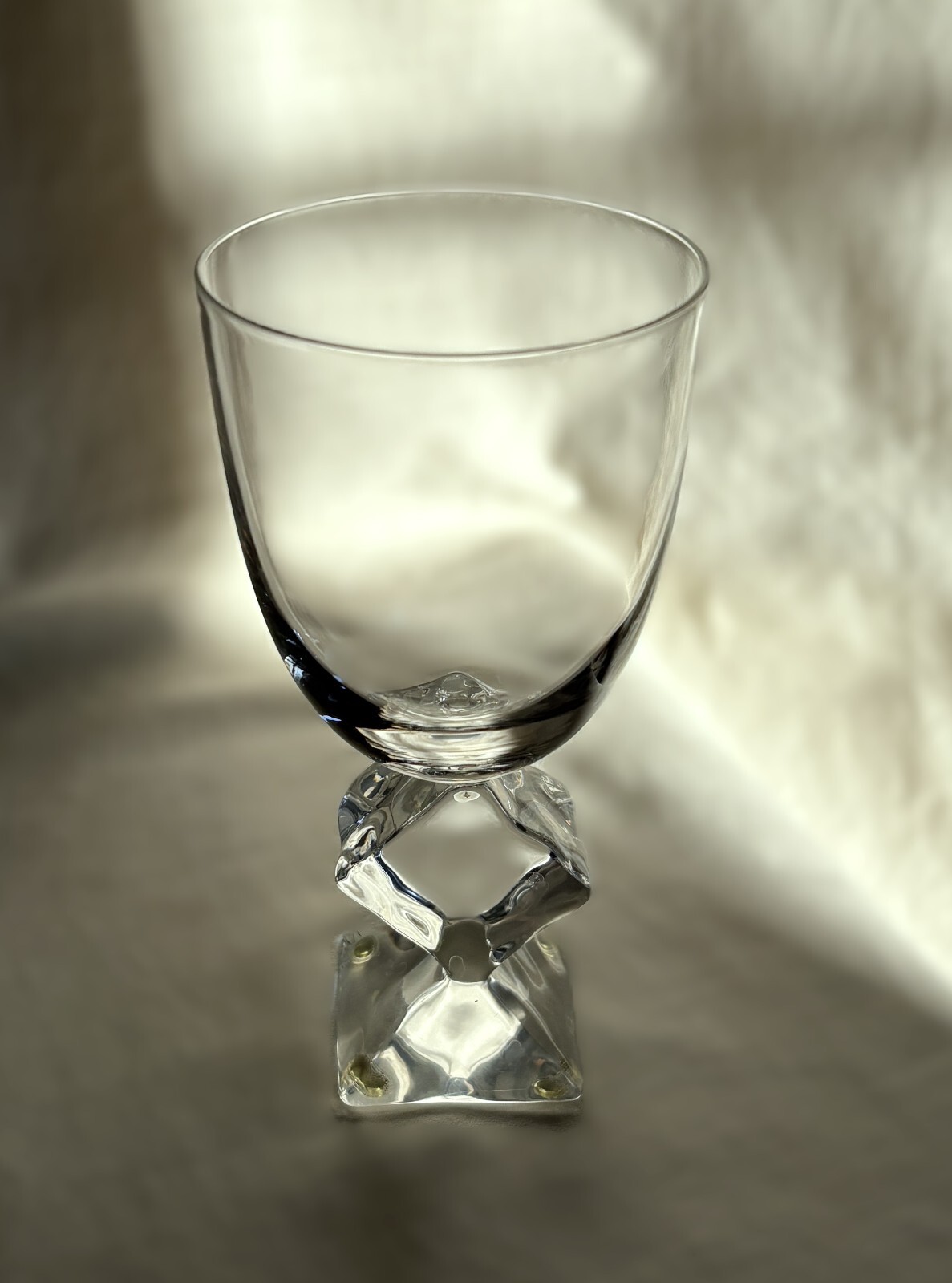 French crystal table glass with Lucite stem melting ice cube. 7″ h. Vintage 1970