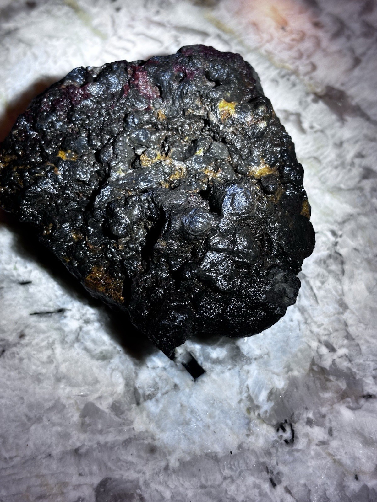 this rock looks like it came from hell! iron ore or silver ore ? meteorite?