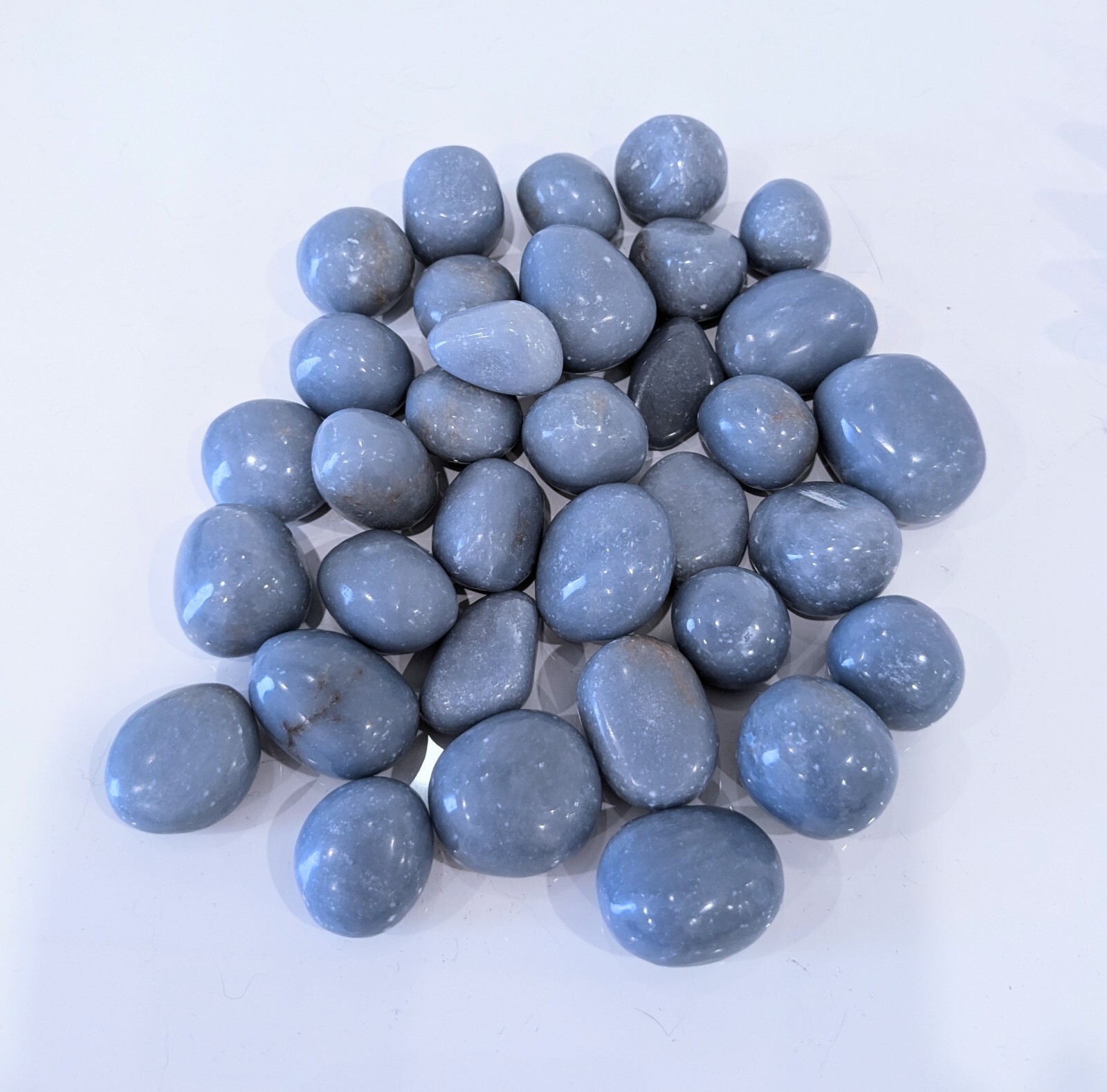 1/2 Pound Tumbled Angelite Crystal 13-15 Pieces p/bag & .75″- 1.25″ in Size