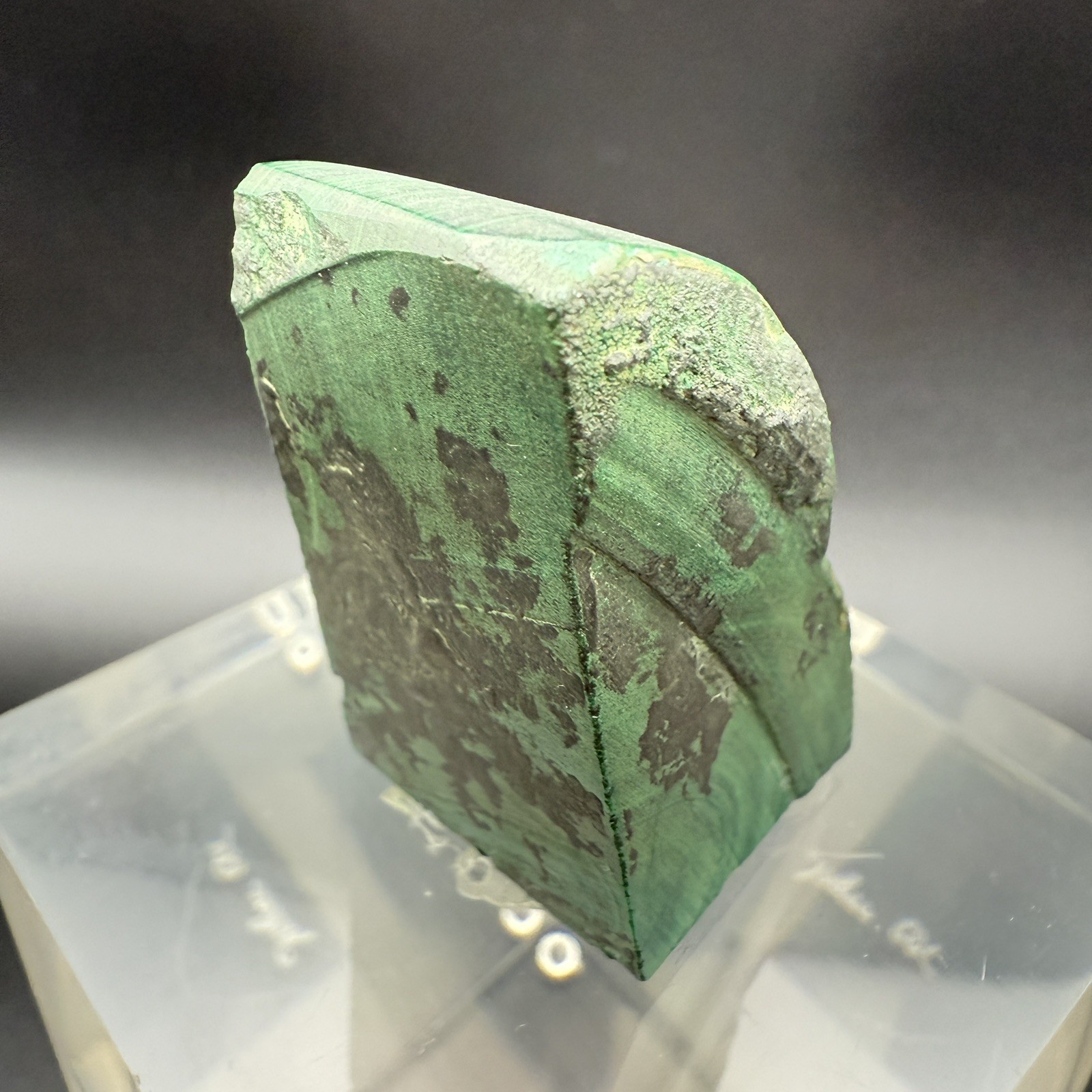 Dark green banded malachite on a lucite Base artist Unknown Signed – “?” Ax