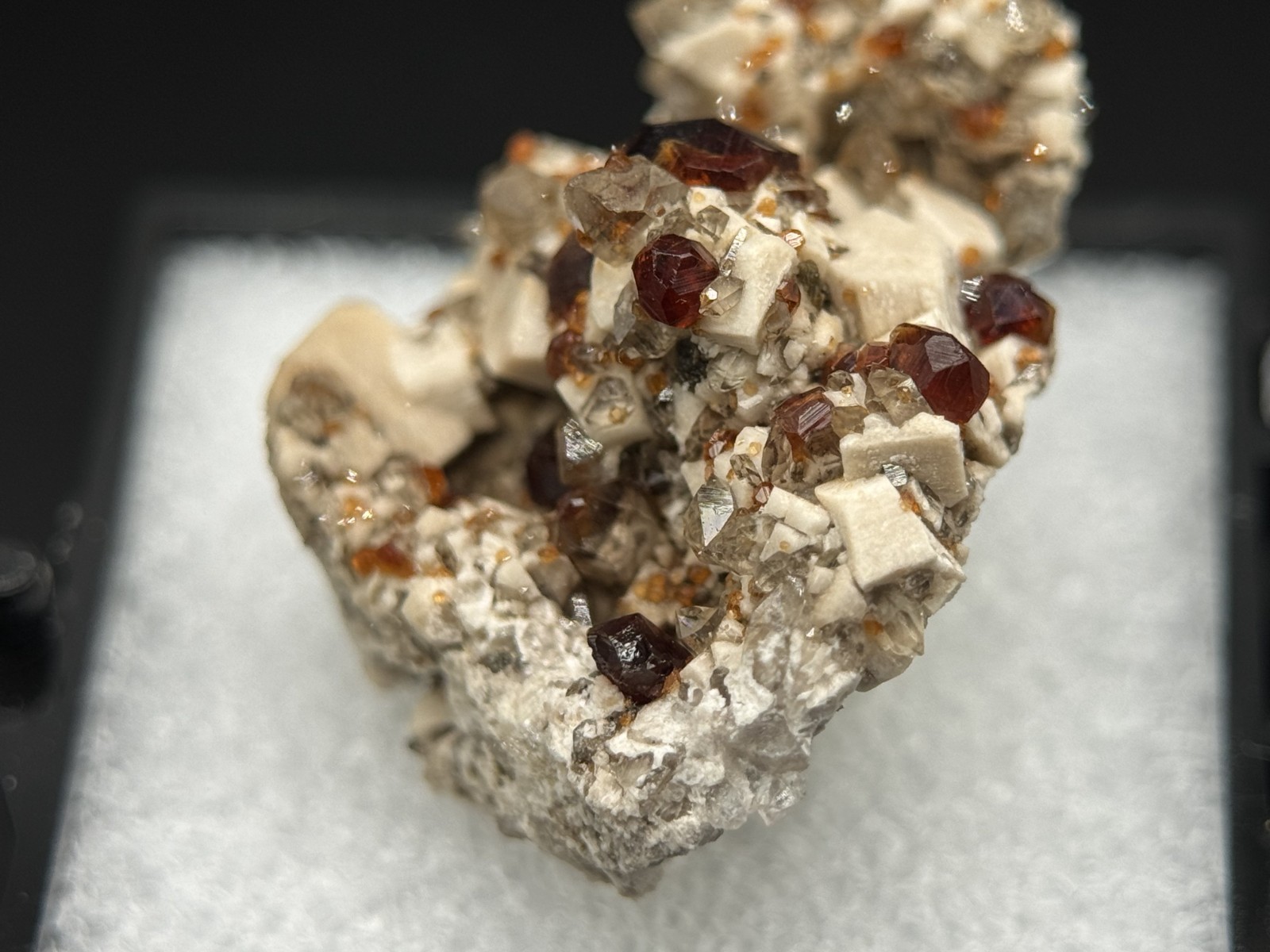 Exceptional spessartine garnets on smoky quartz & microcline from Fujian, China