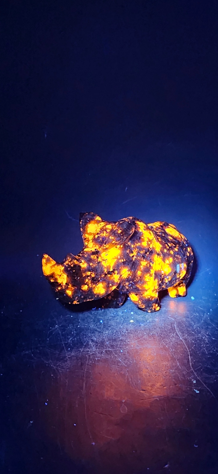 Flame stone “yooperlite” rhino! 8.5 ounces, 4 inches long, 2 tall