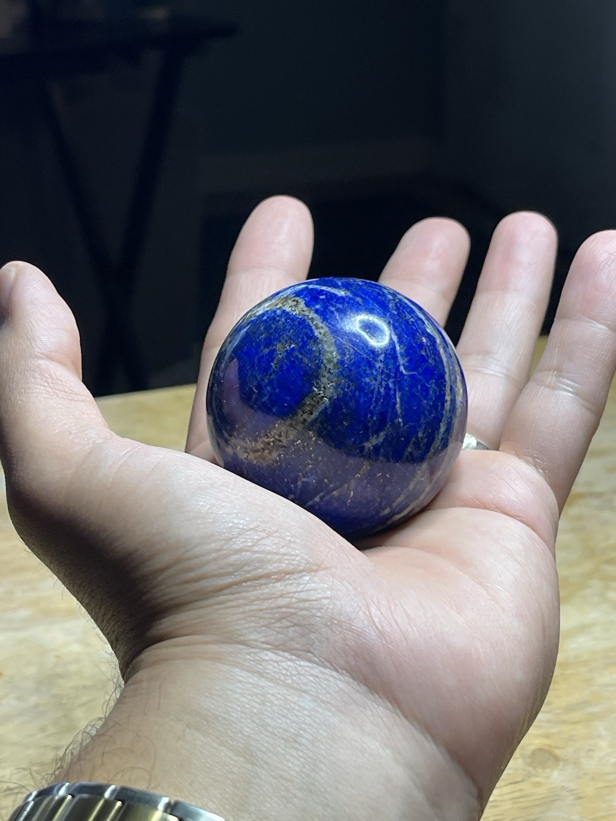 Polished Lapiz Lazuli Sphere with Pyrite Inclusions on Display Stand