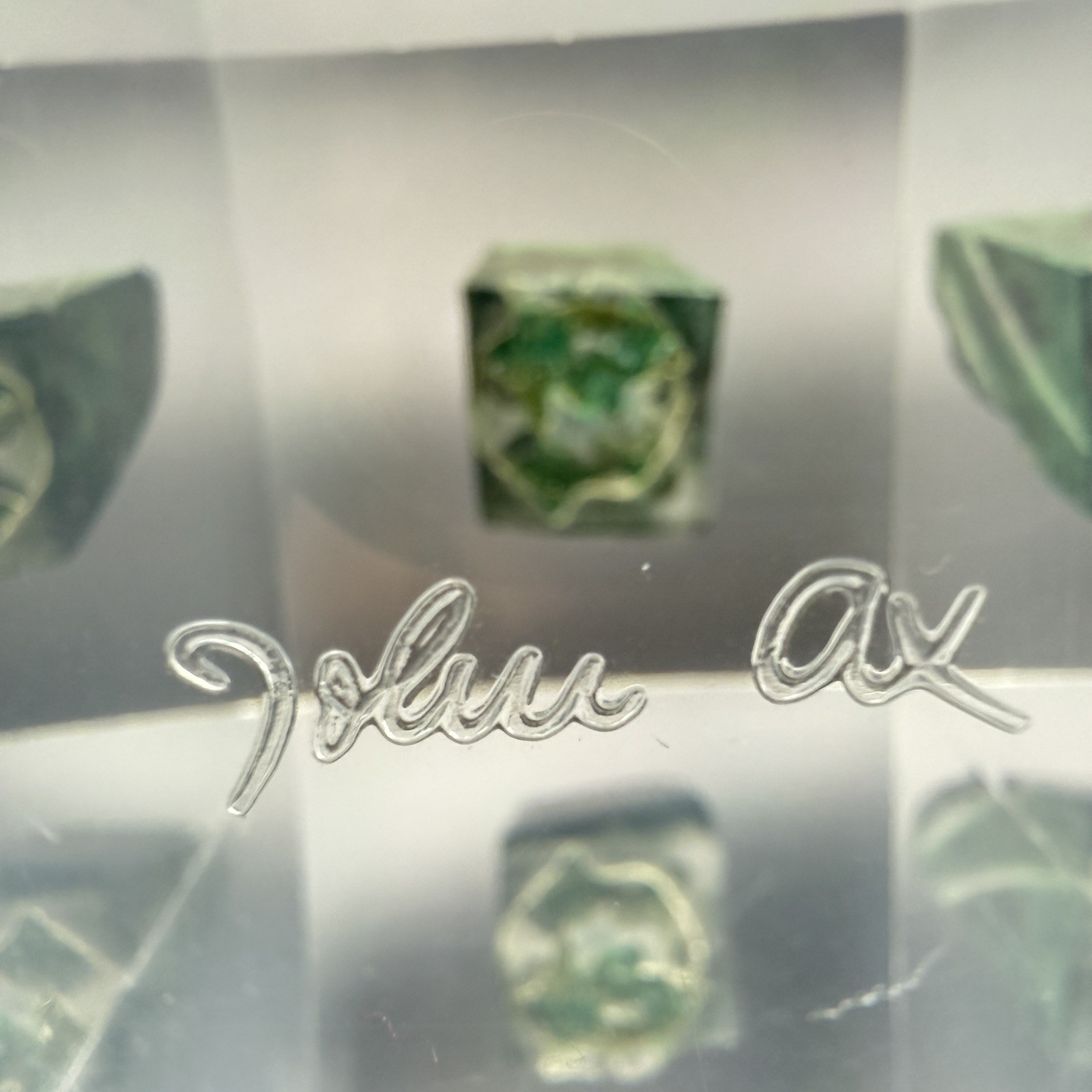 Dark green banded malachite on a lucite Base artist Unknown Signed – “?” Ax