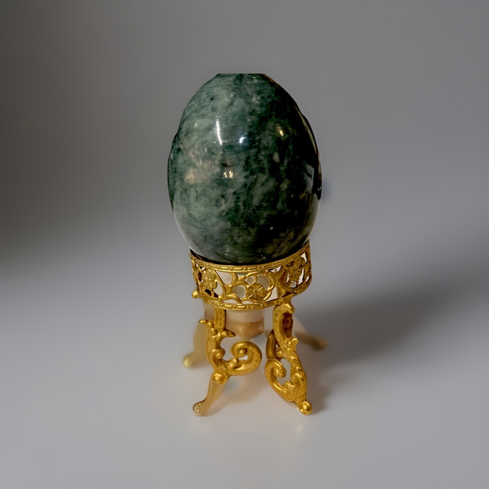 Polished Green Crystal Egg with Ornate Gold Display Stand