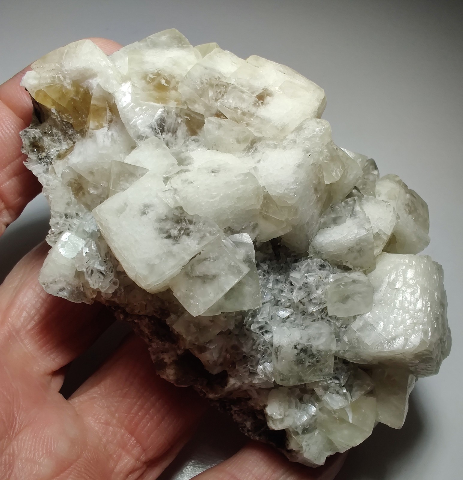 Calcite crystals on matrix, unique form, fluorescent white. 215 grams.