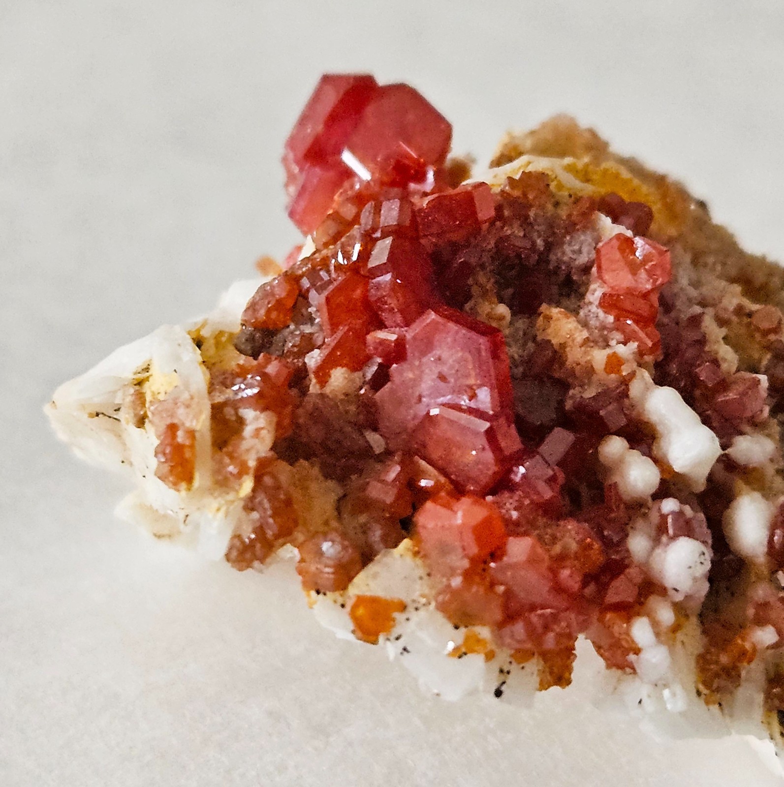 Red and Brown Vanadinite Crystals on white Barite – Mibladen, Morocco