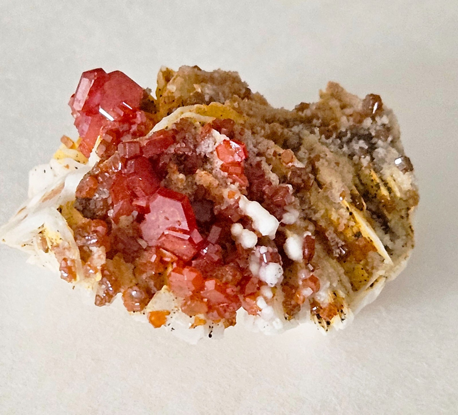 Red and Brown Vanadinite Crystals on white Barite – Mibladen, Morocco