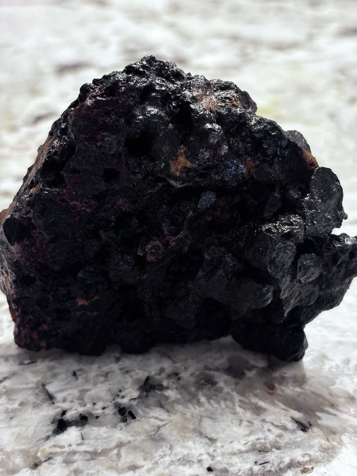 this rock looks like it came from hell! iron ore or silver ore ? meteorite?