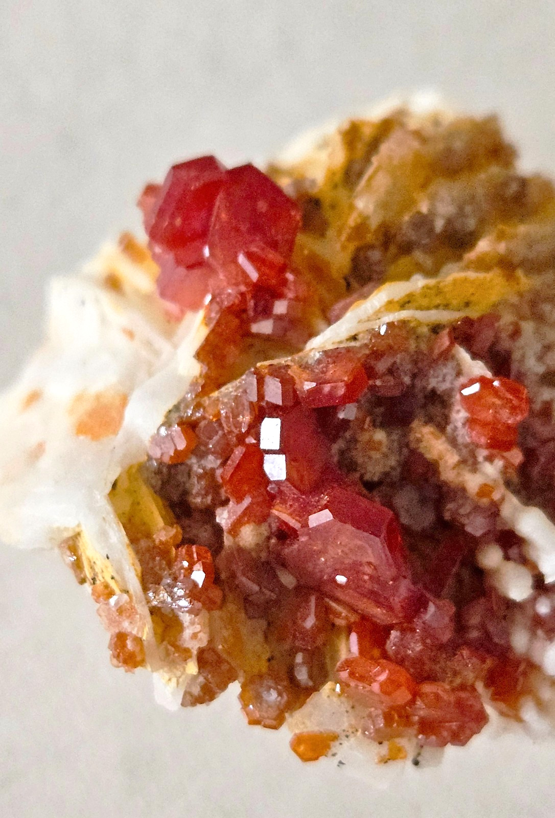 Red and Brown Vanadinite Crystals on white Barite – Mibladen, Morocco