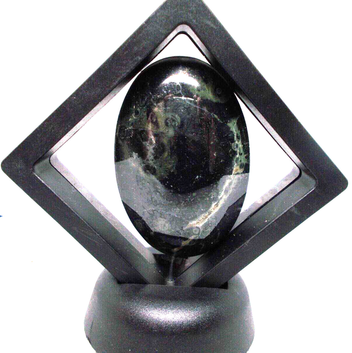 Kumbala jasper palm stone 2 1/2″ x 1 1/2″ in display frame