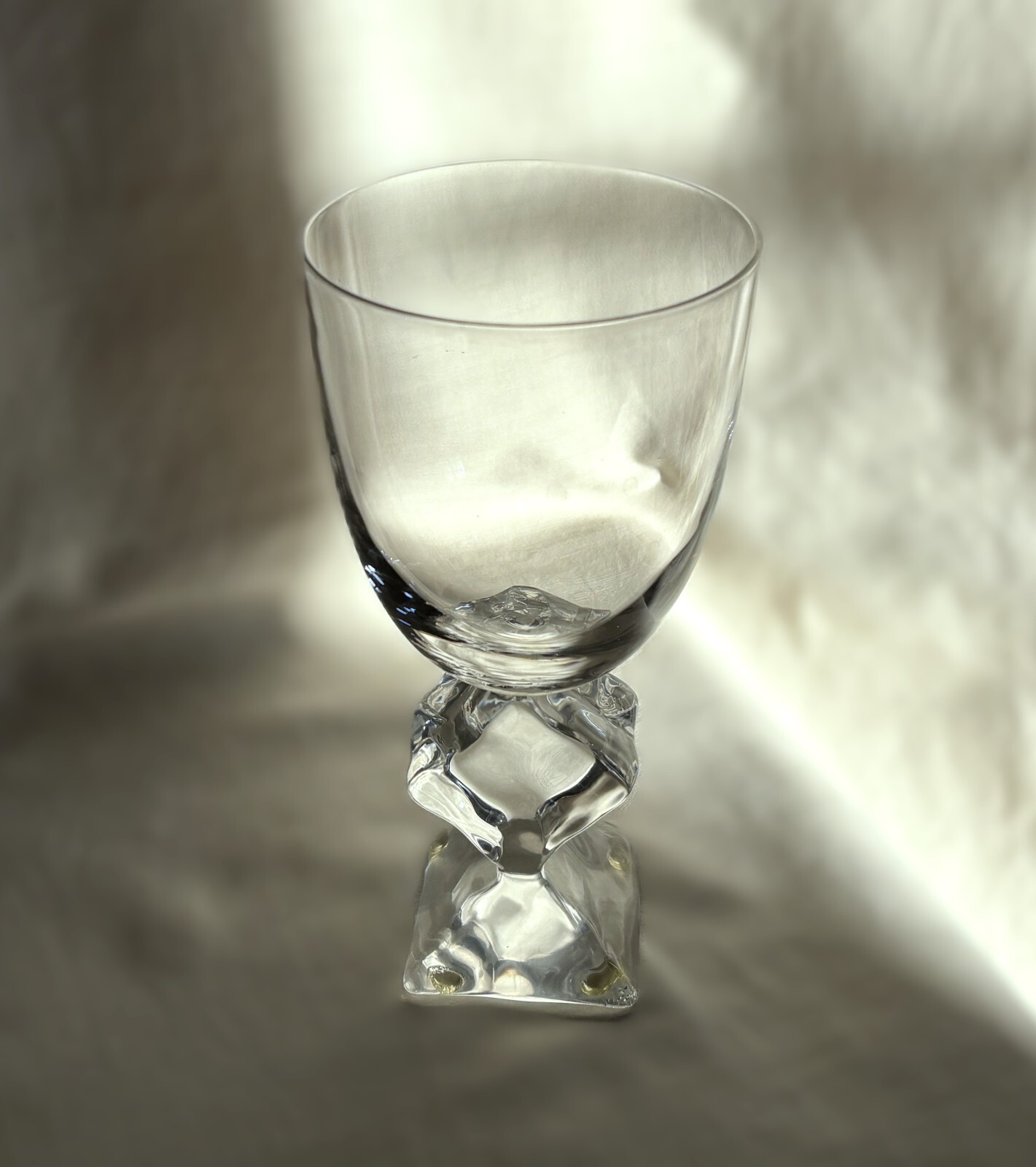 French crystal table glass with Lucite stem melting ice cube. 7″ h. Vintage 1970