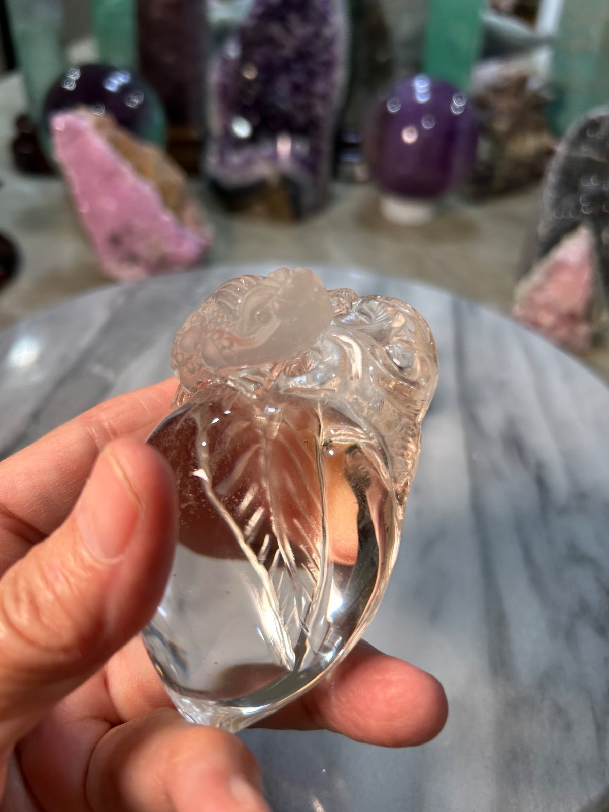 Clear quartz Golden Toad on peach carving very clear