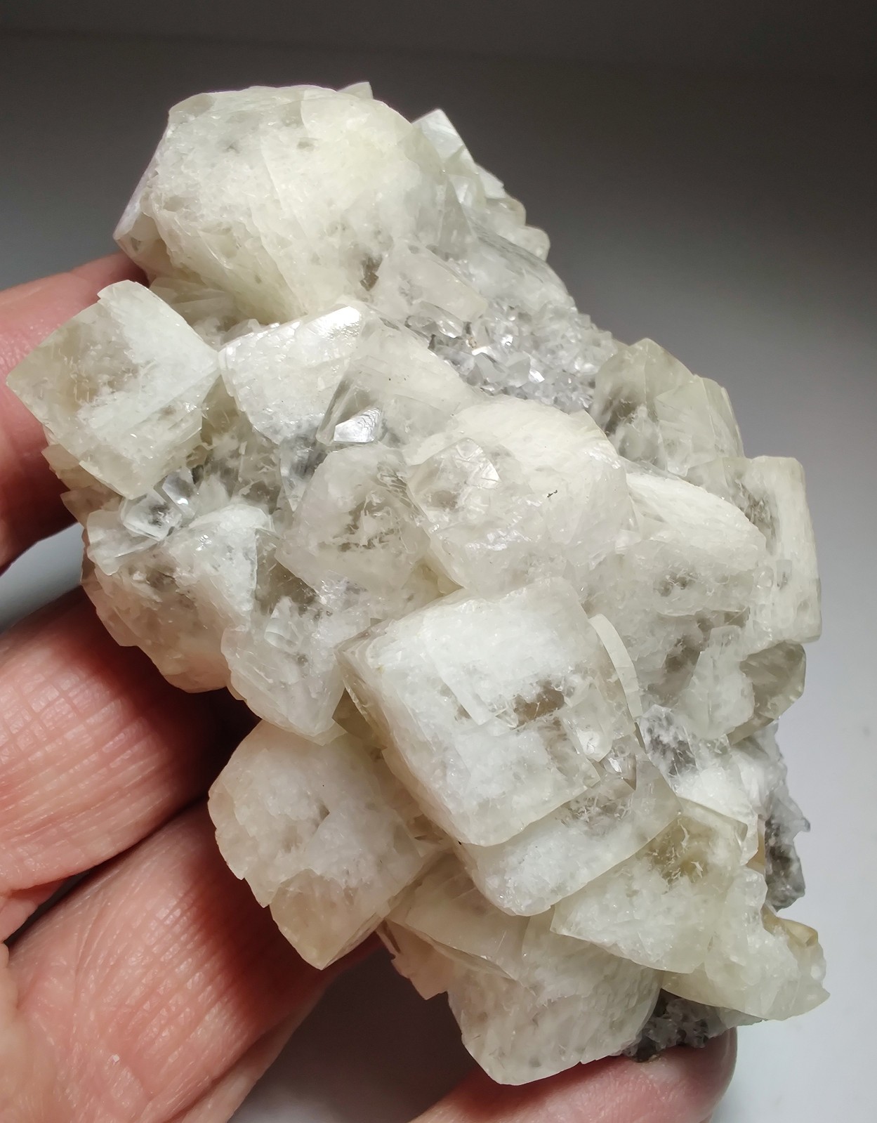 Calcite crystals on matrix, unique form, fluorescent white. 215 grams.