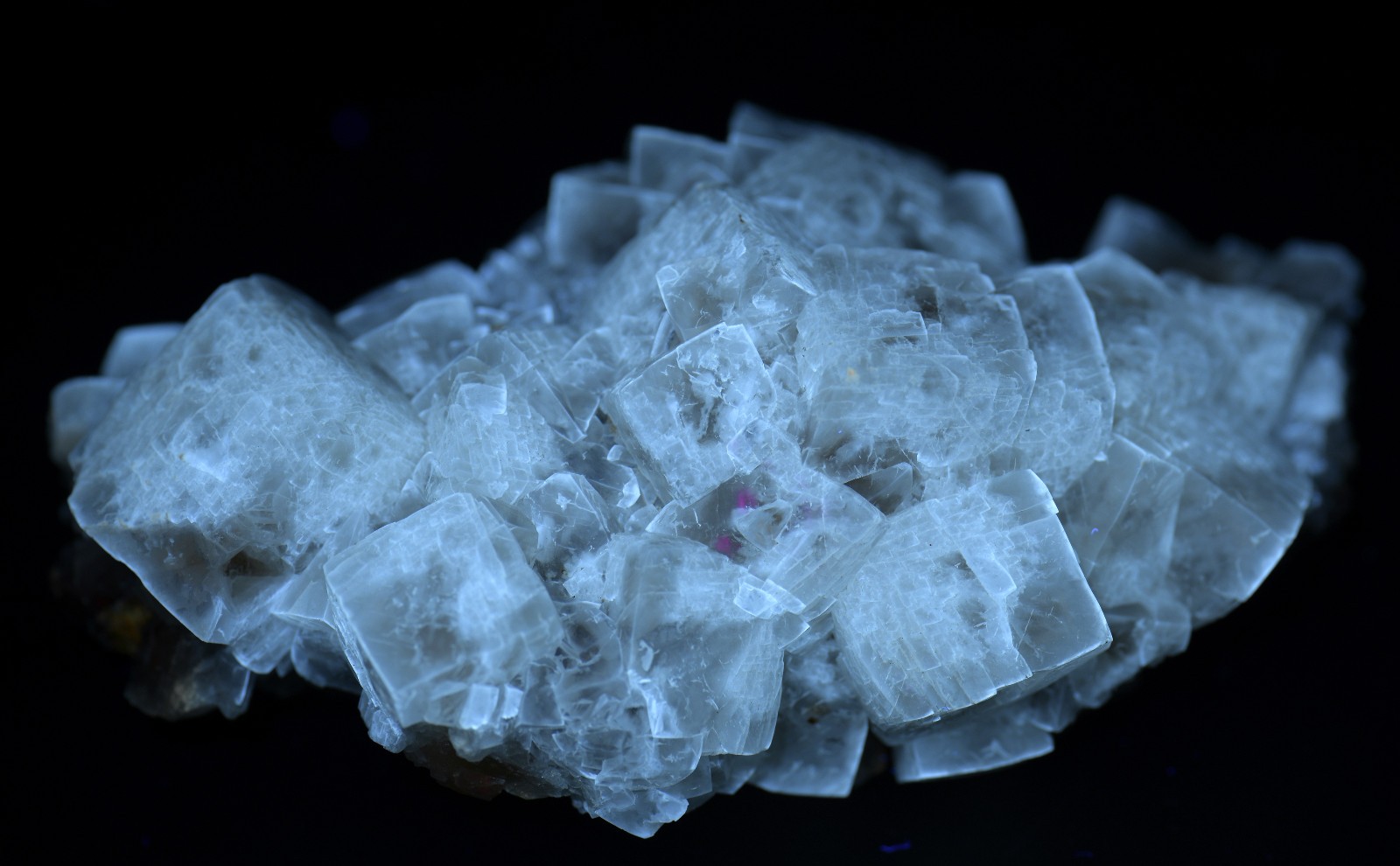 Calcite crystals on matrix, unique form, fluorescent white. 215 grams.