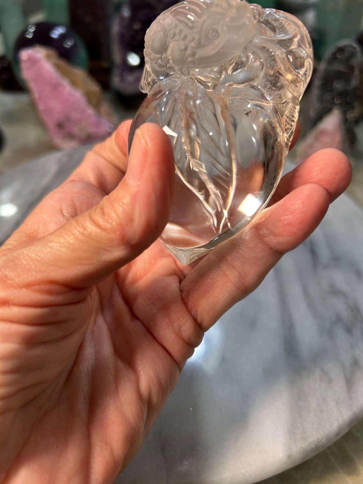 Clear quartz Golden Toad on peach carving very clear