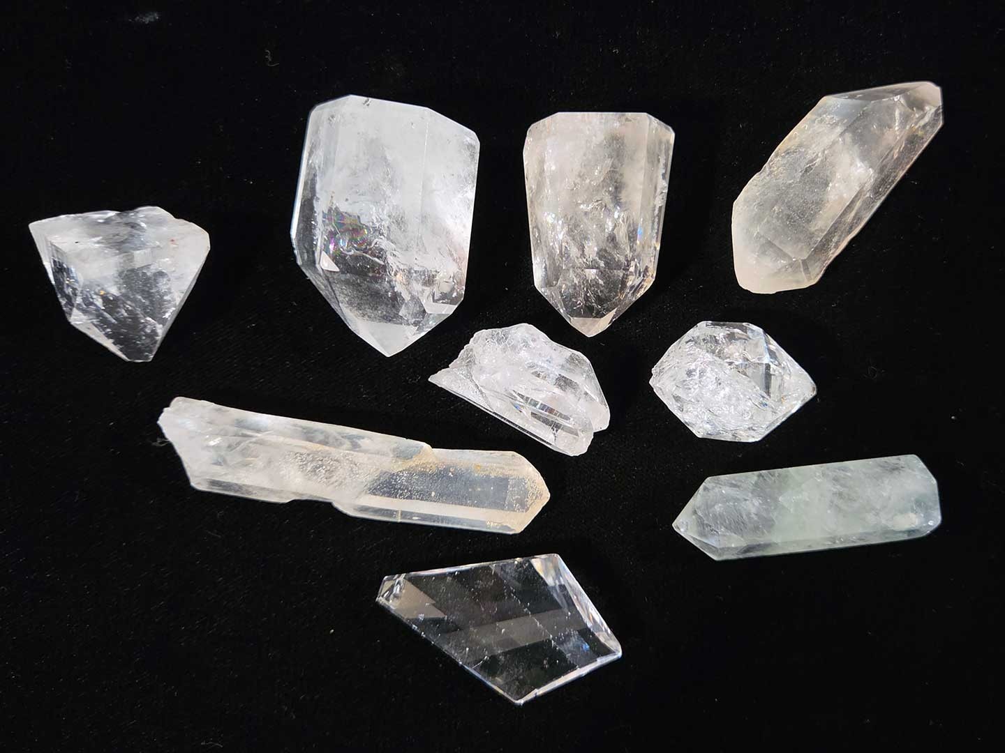 Collection of 9 clear quartz crystal points, 1in. to 3in.