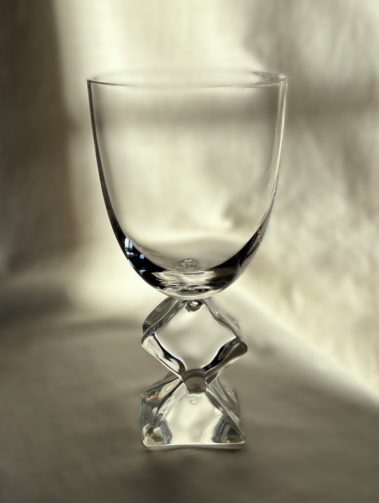 French crystal table glass with Lucite stem melting ice cube. 7″ h. Vintage 1970