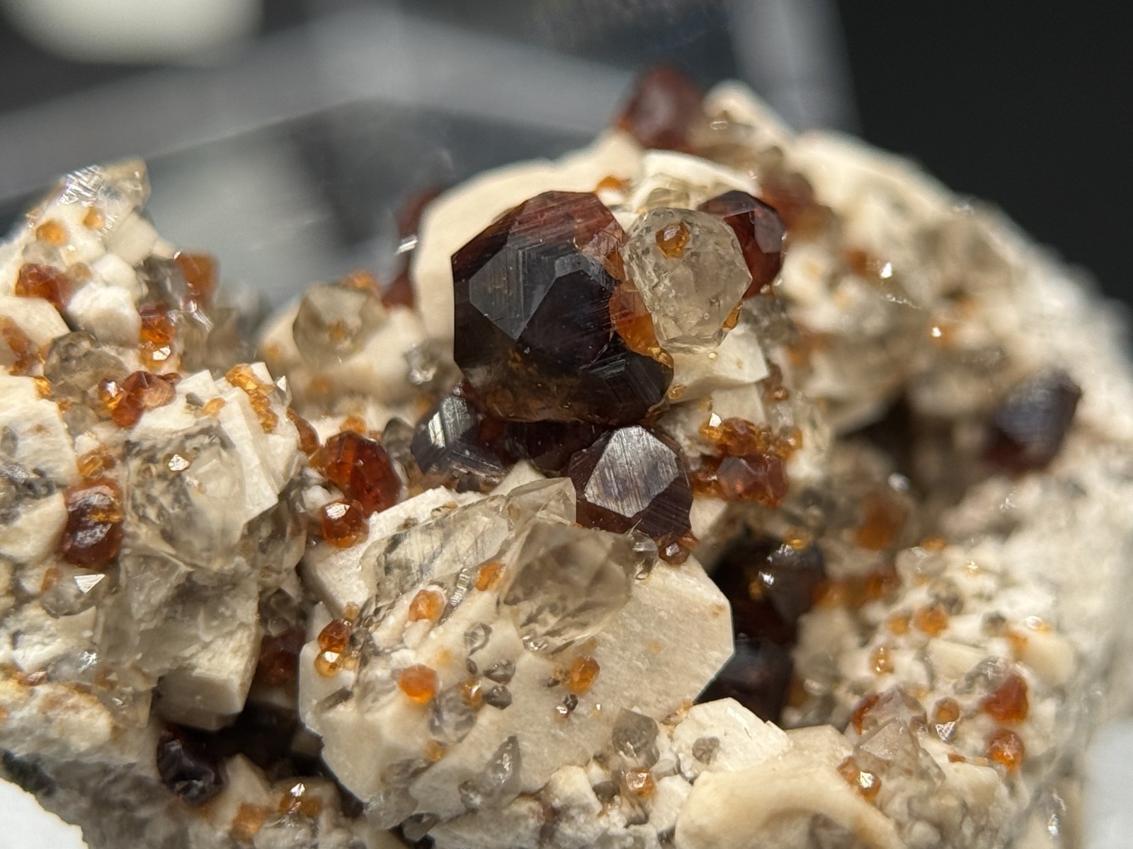Exceptional spessartine garnets on smoky quartz & microcline from Fujian, China