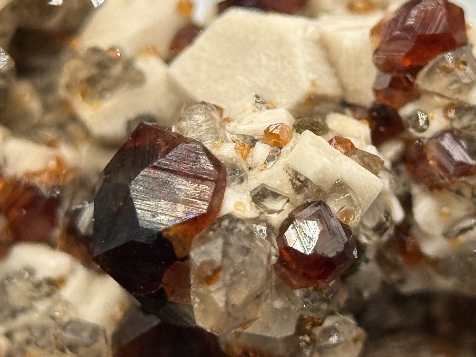 Exceptional spessartine garnets on smoky quartz & microcline from Fujian, China