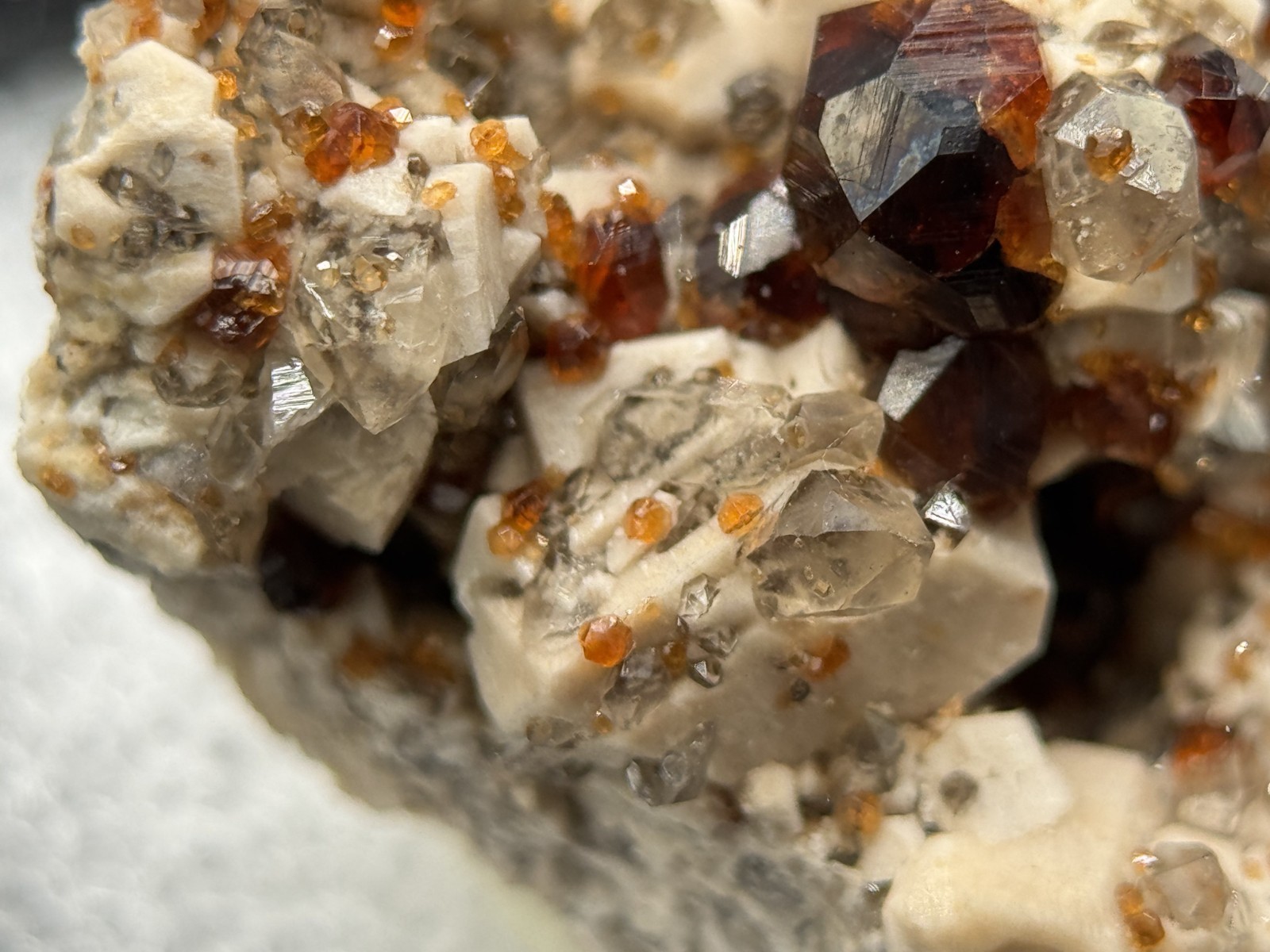 Exceptional spessartine garnets on smoky quartz & microcline from Fujian, China