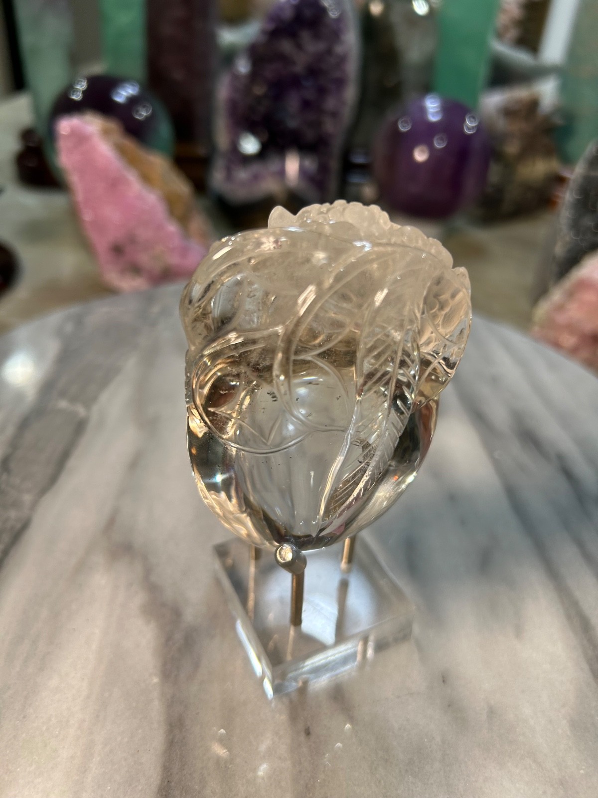 Clear quartz Golden Toad on peach carving very clear