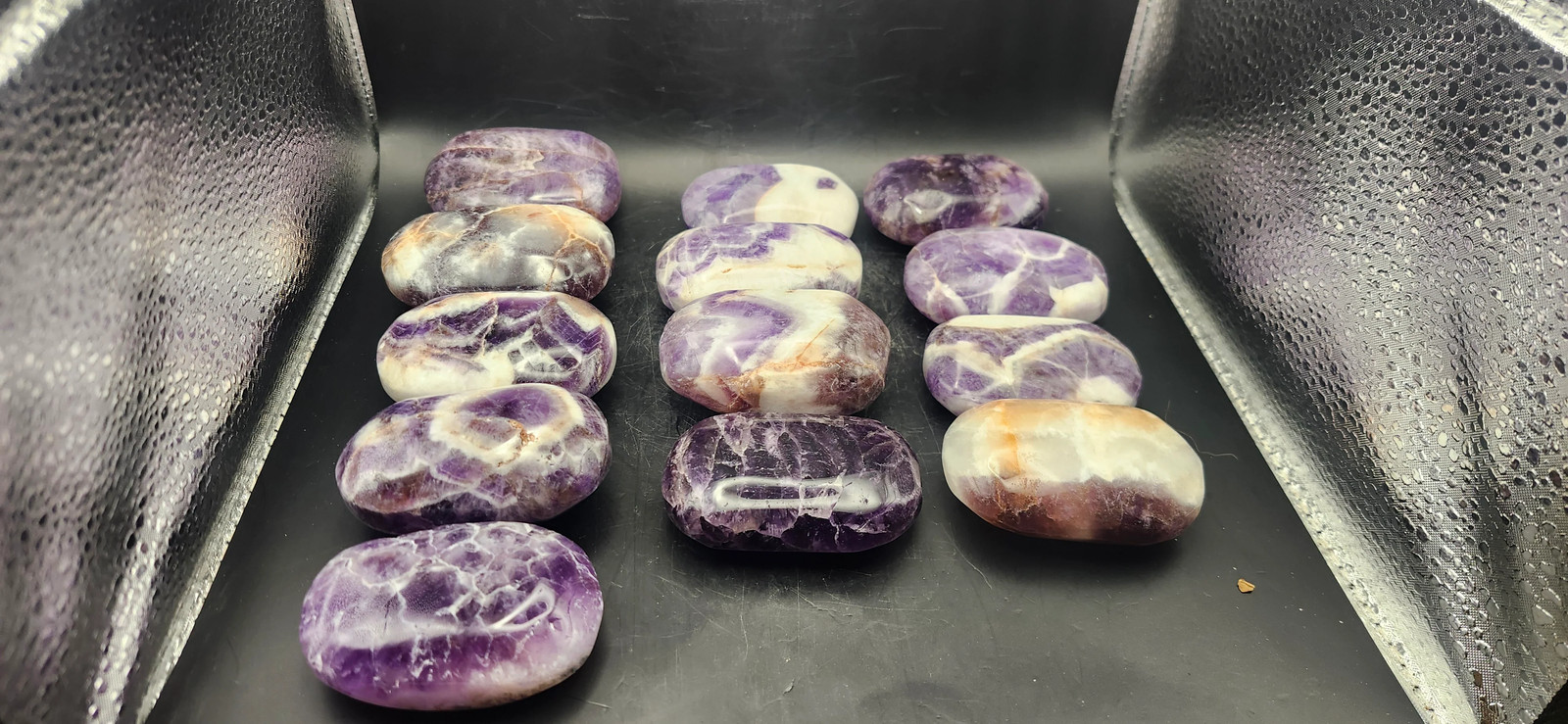 Dream amethyst palm stone! 2 too 4 ounces 2 inches long, 1.5 wide