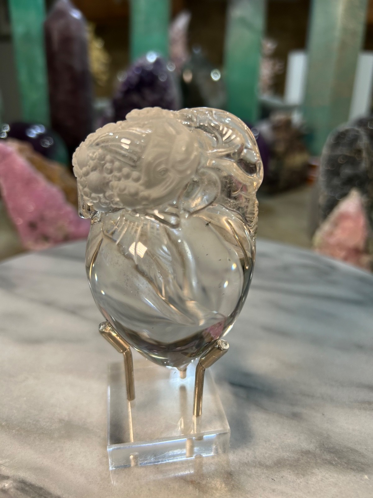 Clear quartz Golden Toad on peach carving very clear