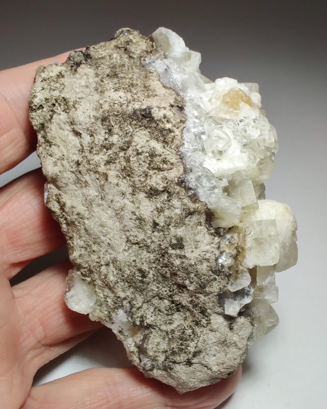 Calcite crystals on matrix, unique form, fluorescent white. 215 grams.