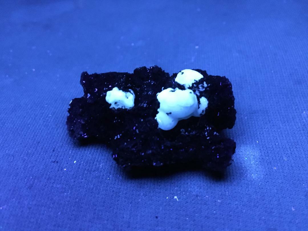 KB: FANTASTIC! BRIGHT FL. & PHOS. BLUE/WHITE SW CALCITE IN LAVA ROCK, GERMANY