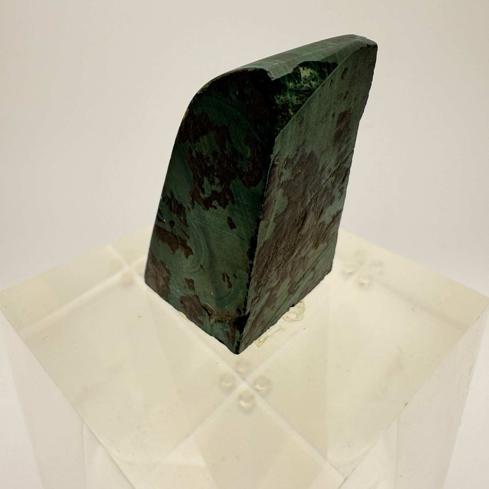 Dark green banded malachite on a lucite Base artist Unknown Signed – “?” Ax