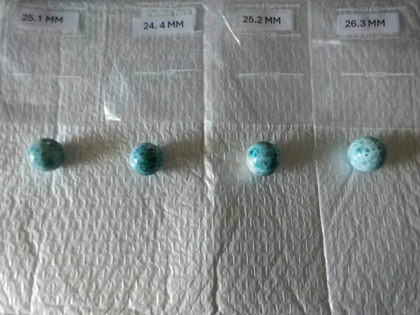 DOMINICAN REPUBLIC LARIMAR SPHERES LOT OF FOUR 24 MM TO 26 MM