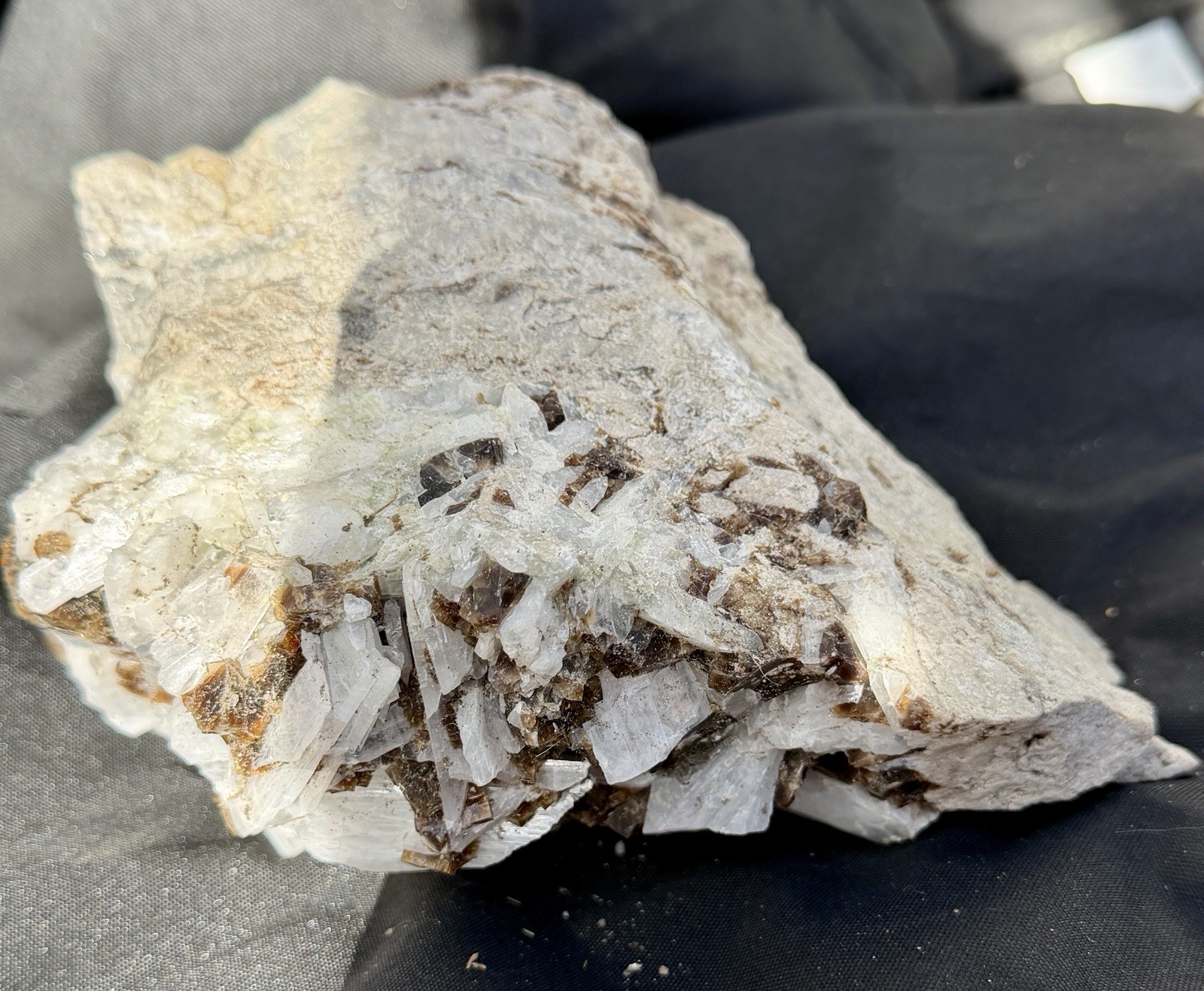 Mineral specimen containing brown fluorite and white celestite crystals.