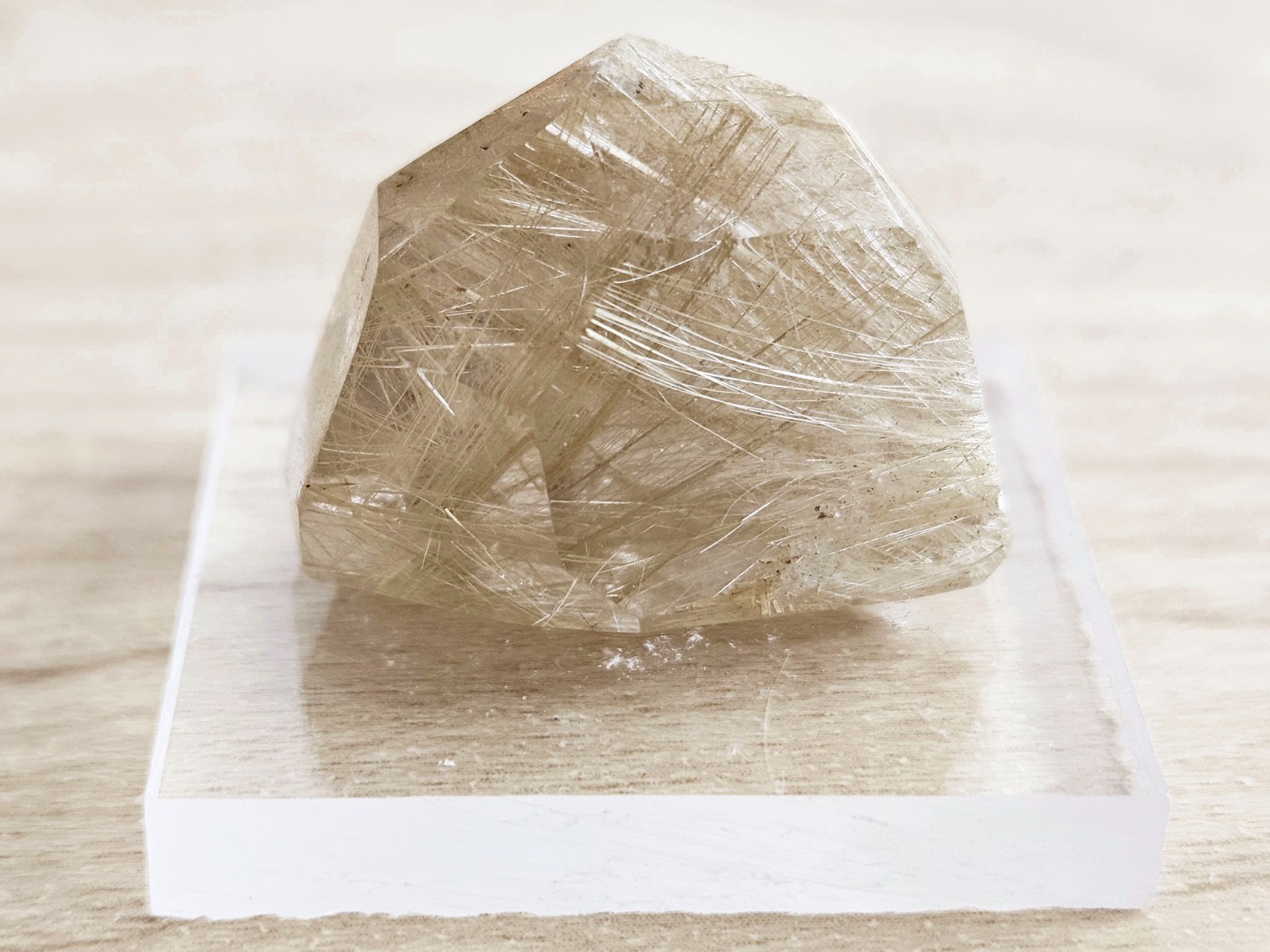 Lustrous Golden Rutile in Quartz Point, Brazil, 1” x 0.8” x 0.7” + Free Stand