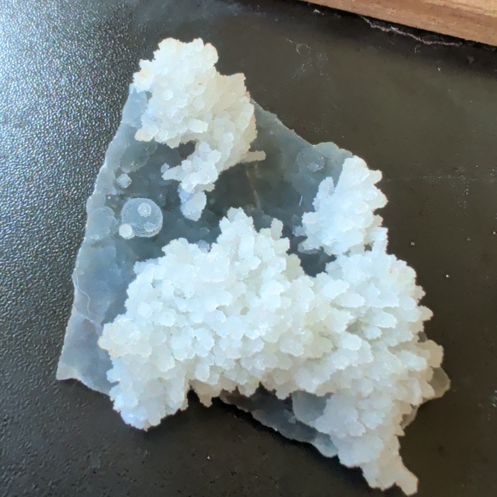 White flower formations atop a blue chalcedony base Mineral Display Piece Raw