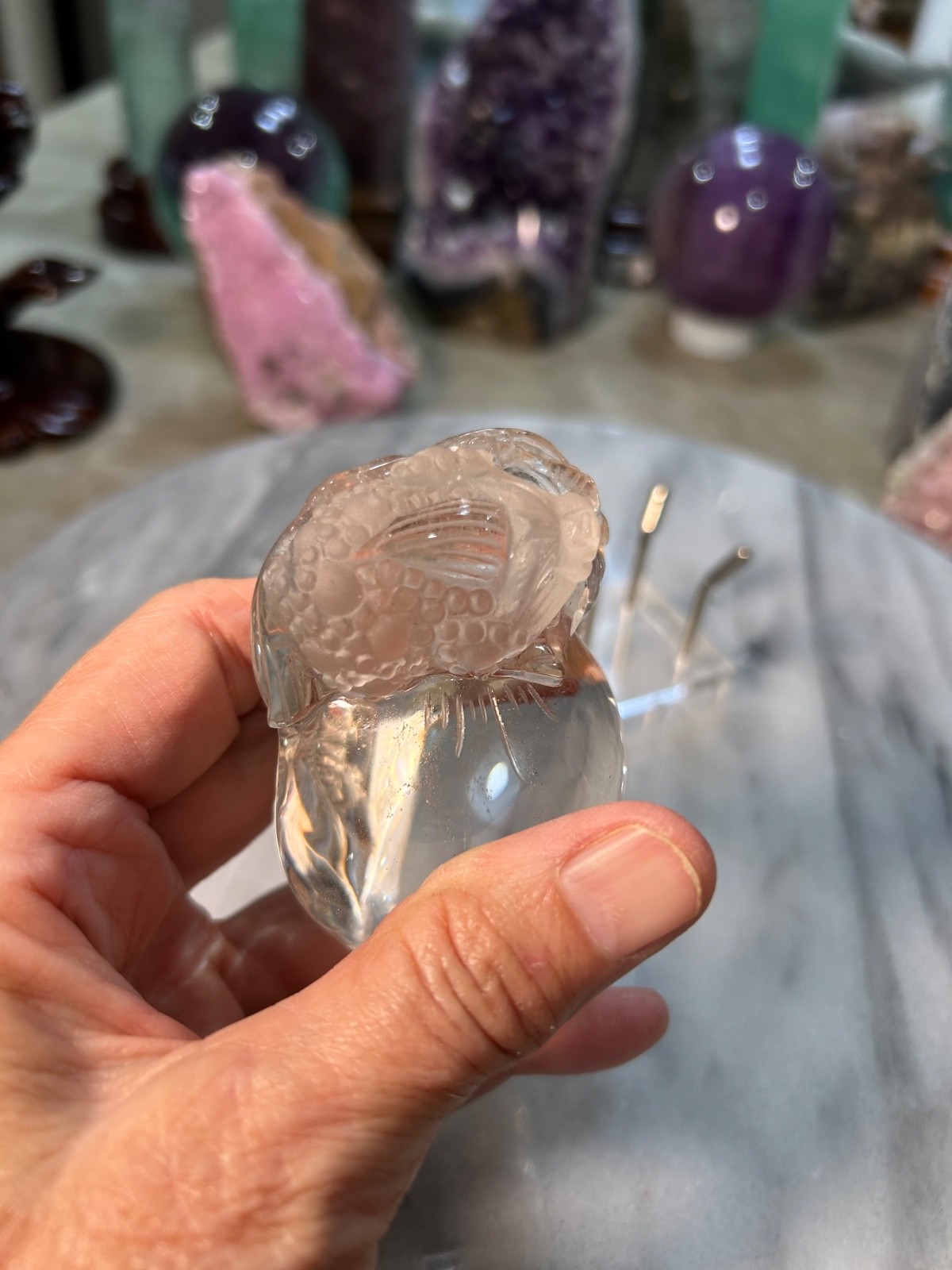 Clear quartz Golden Toad on peach carving very clear