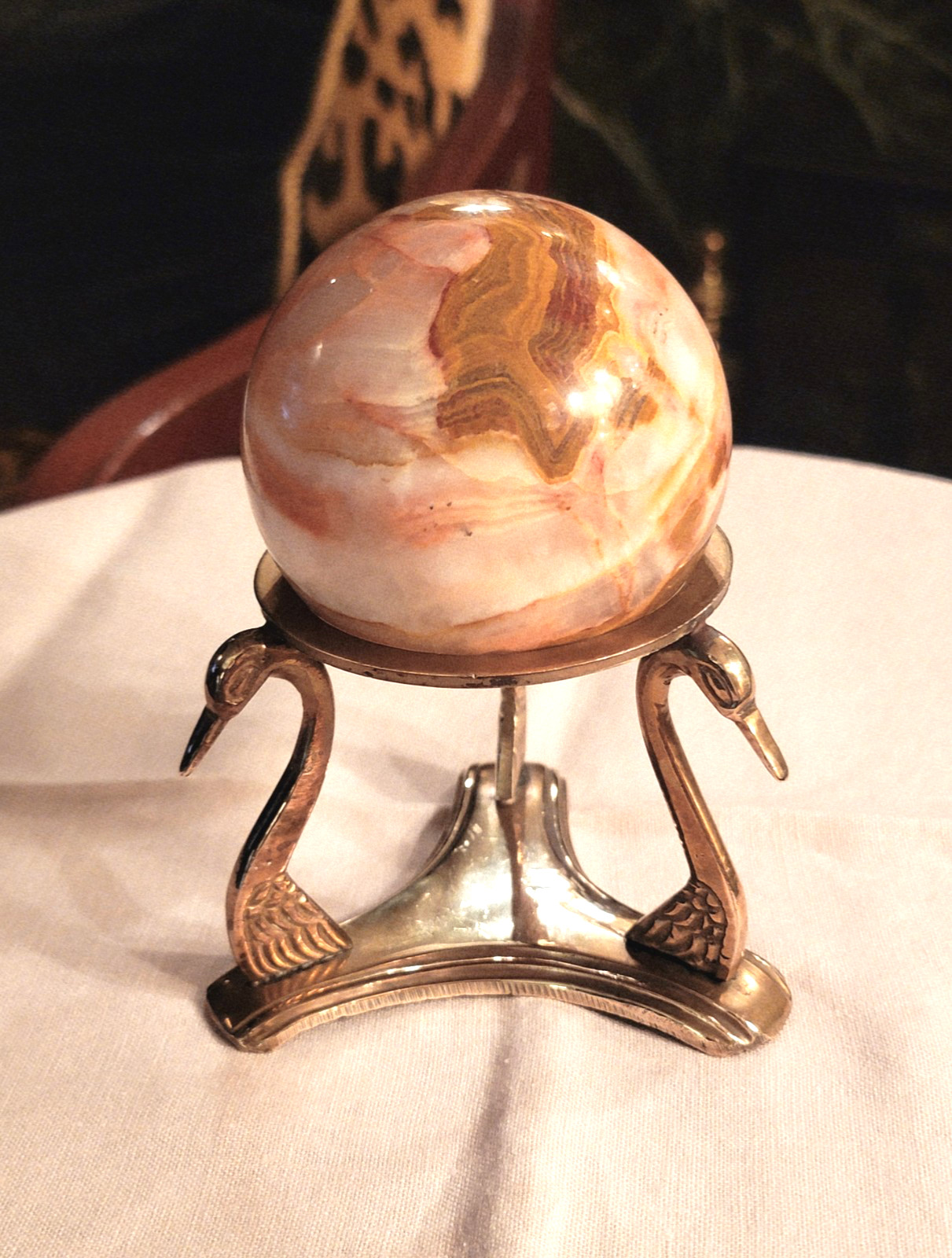 BEAUTIFUL RHODOCHROSITE SPHERE WITH POLISHED BRASS SWAN-HEADS STAND, 5’’