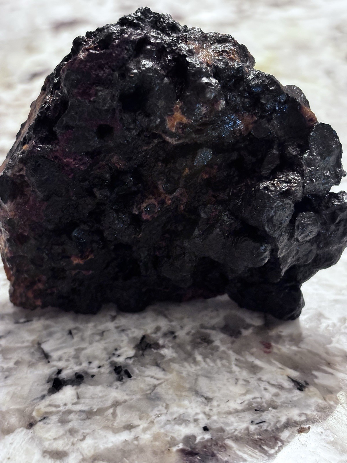 this rock looks like it came from hell! iron ore or silver ore ? meteorite?