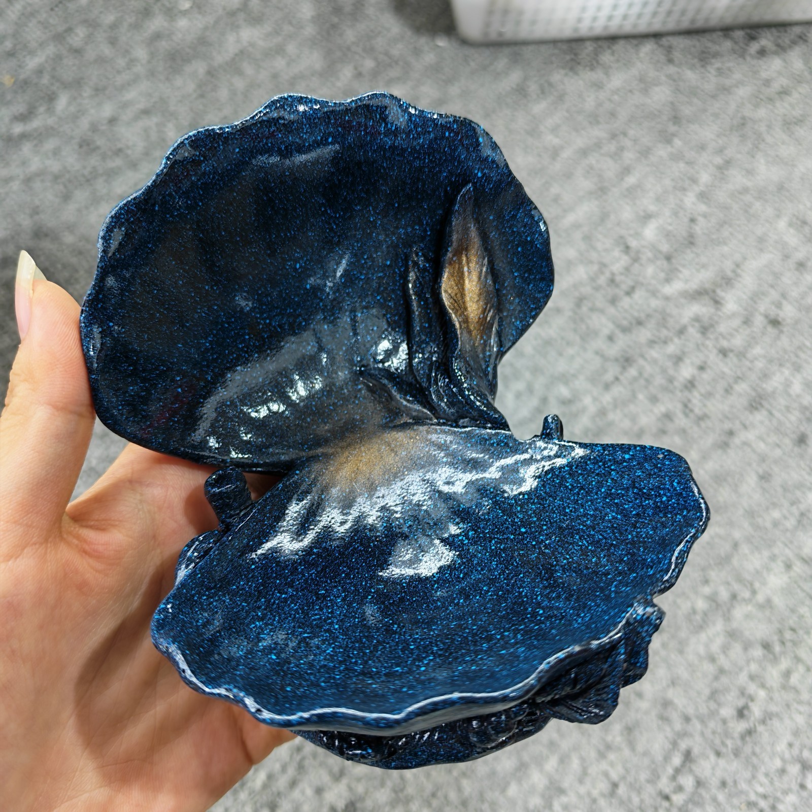dark blue clamshell stand for natural crystal sphere