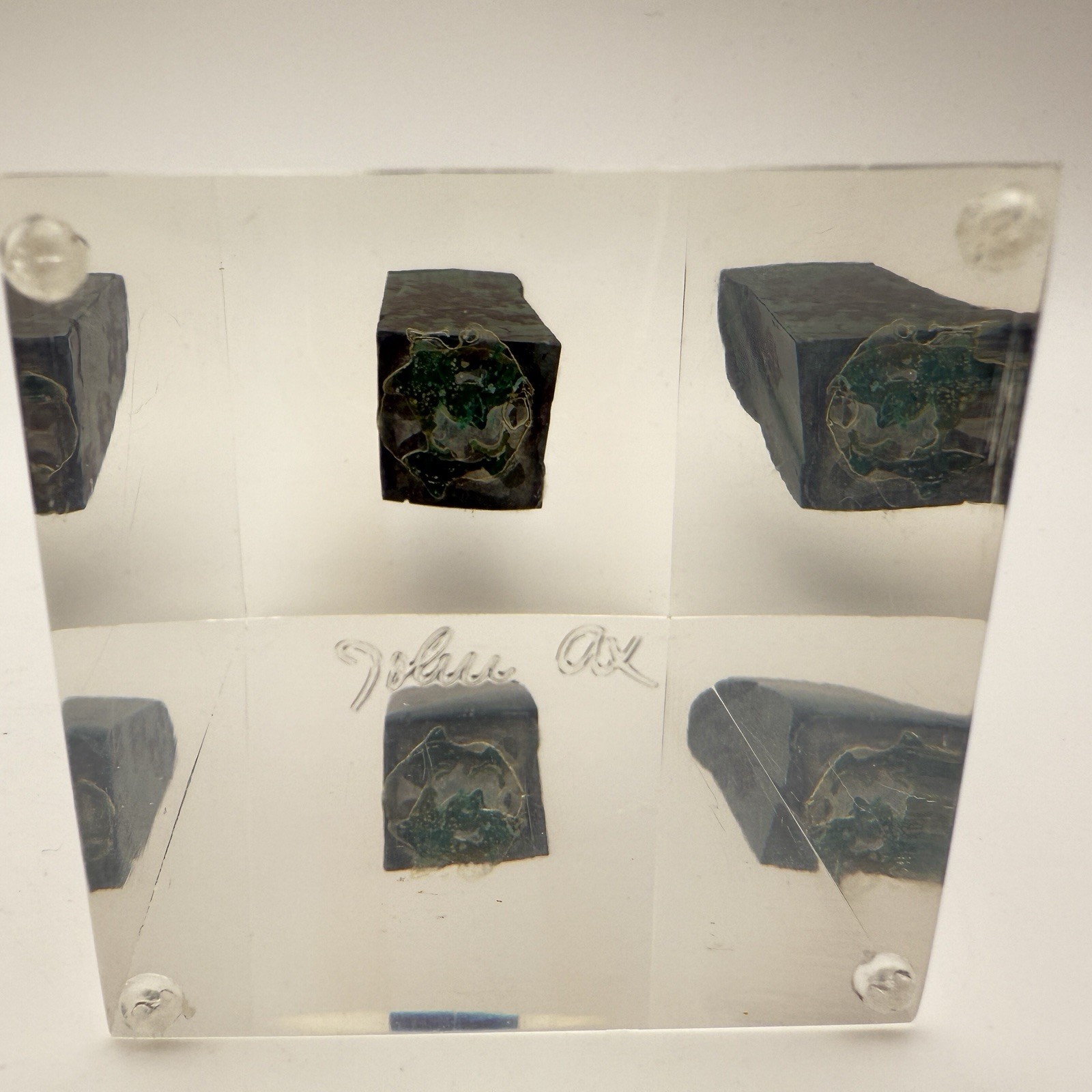 Dark green banded malachite on a lucite Base artist Unknown Signed – “?” Ax