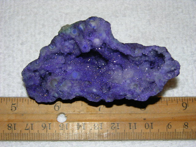 Geode cut & polished half with colored crystal center 3.5 inch E57