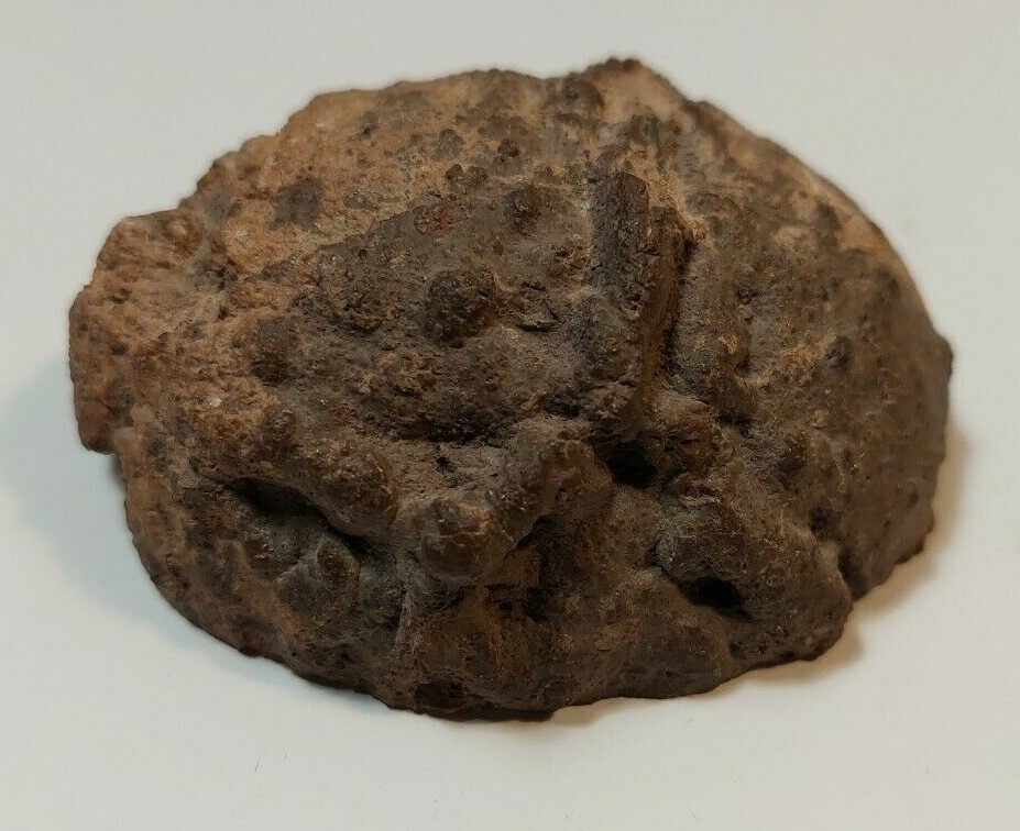 ENHYDRO AGATE GEODE. 3″ X 2 1/2″. LIGHT SHINES THRU LEAVES A YELLOWISH HUE