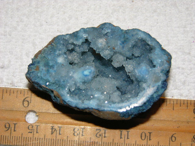 Geode cut & polished half with colored crystal center 2.5 inch E35