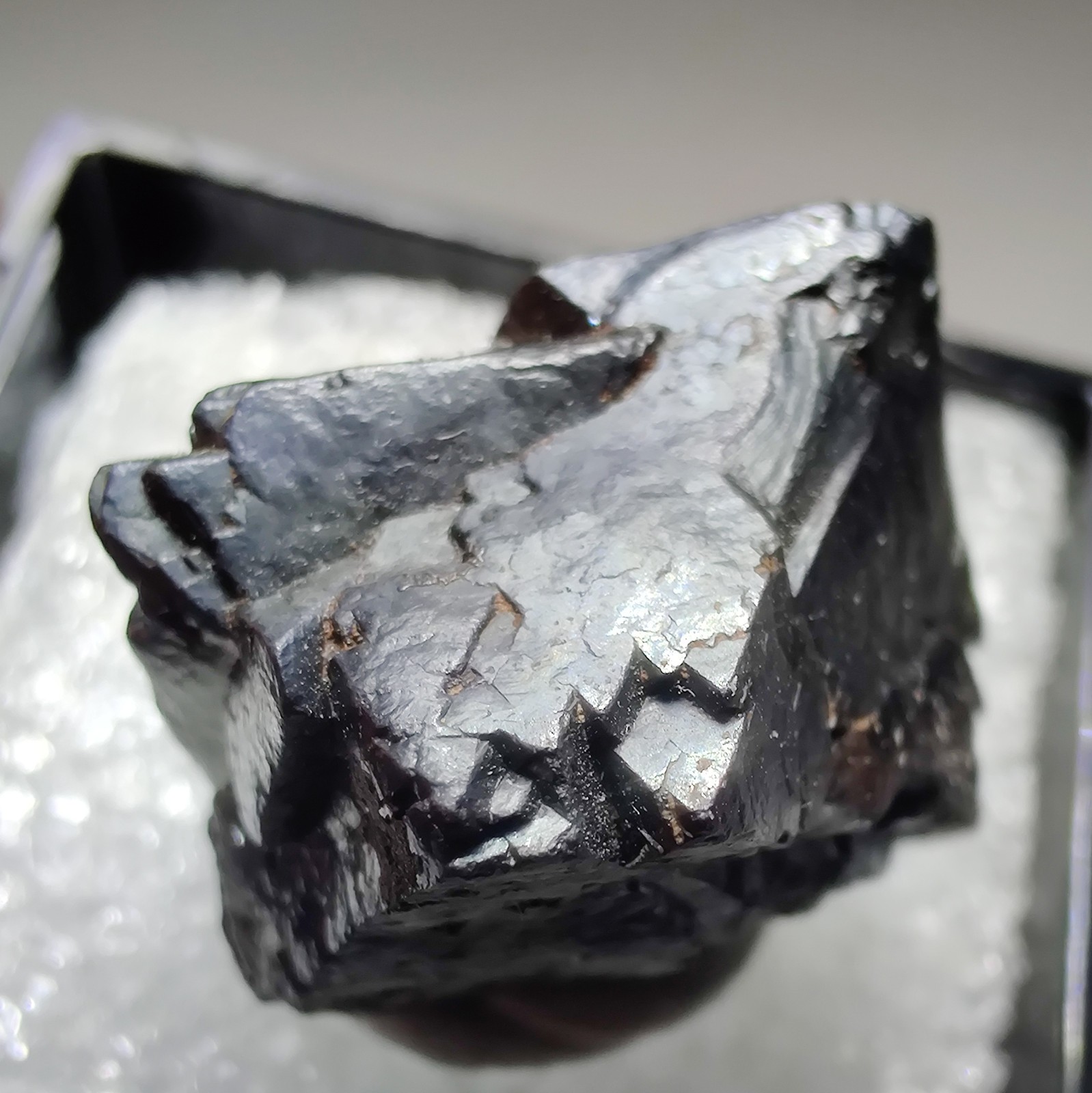 Twinned Magnetite crystal, sharp! San Calixto Prospect, Bolivia. 2 cm.
