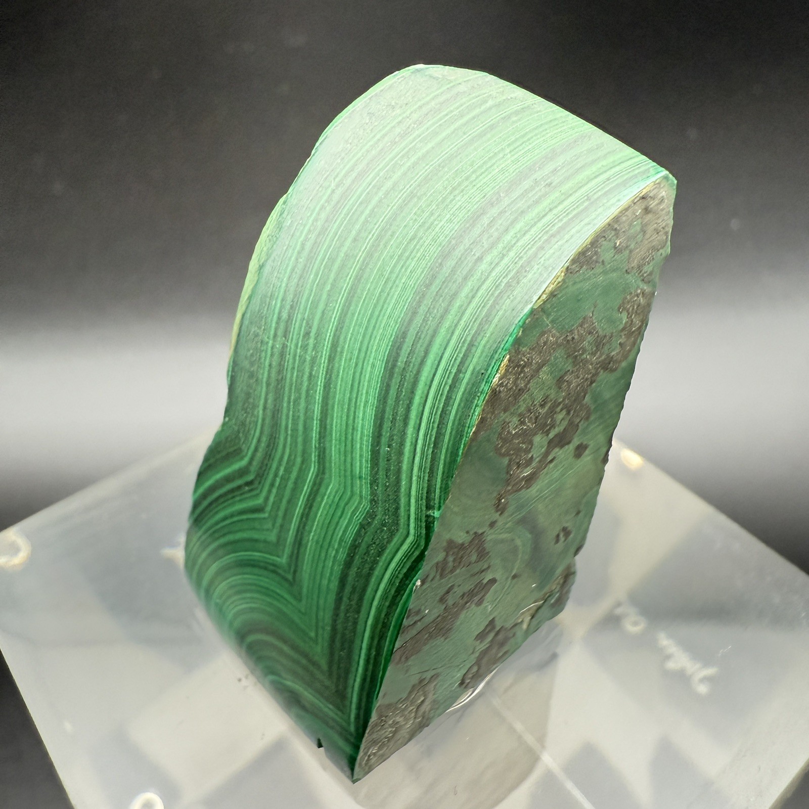Dark green banded malachite on a lucite Base artist Unknown Signed – “?” Ax