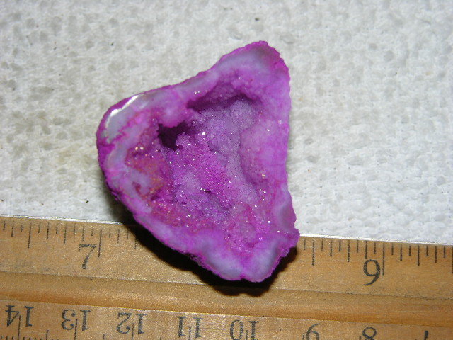 Geode cut & polished half with colored crystal center 1.5 inch E1