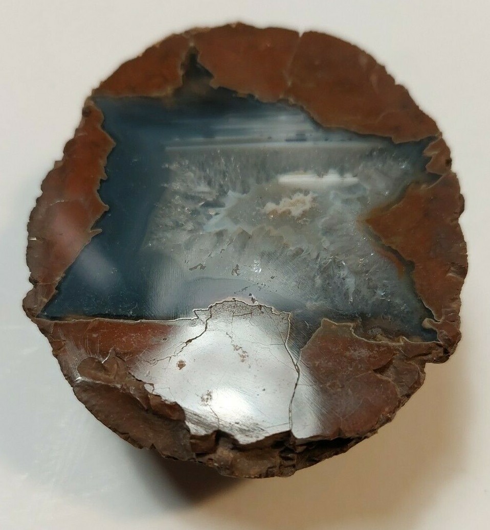 ENHYDRO AGATE GEODE. 3″ X 2 1/2″. LIGHT SHINES THRU LEAVES A YELLOWISH HUE