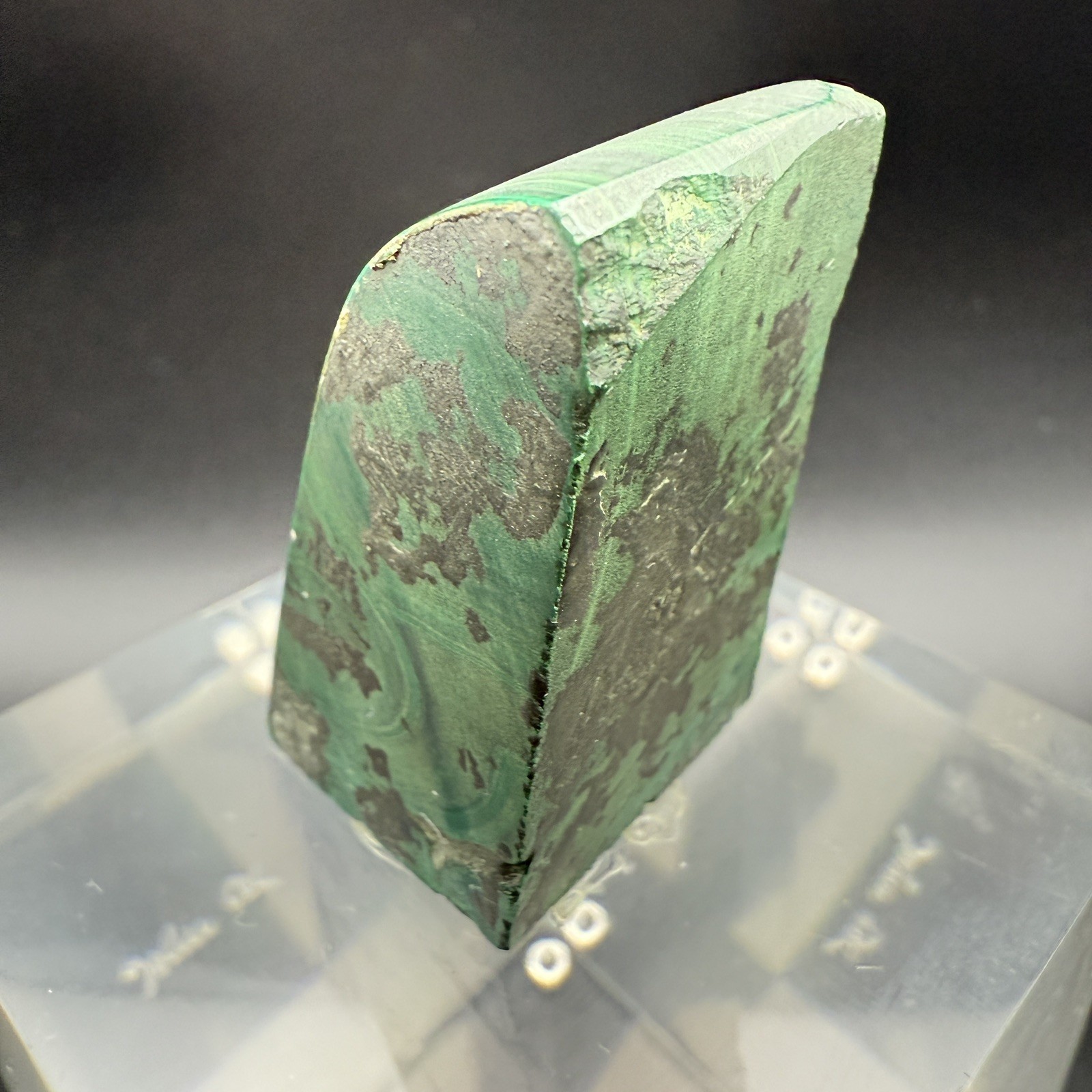 Dark green banded malachite on a lucite Base artist Unknown Signed – “?” Ax
