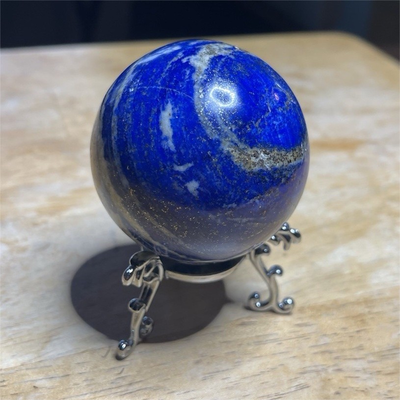 Polished Lapiz Lazuli Sphere with Pyrite Inclusions on Display Stand