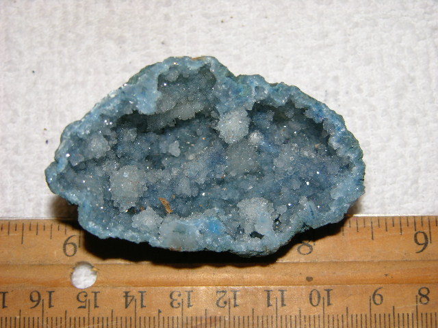 Geode cut & polished half with colored crystal center 2.5 inch E60